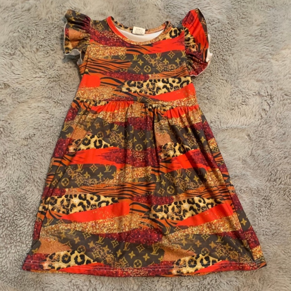 Stylish Kids Dress with Animal Print and Red Accents